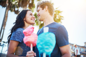 boyfriend and girlfriend on romantic date with cotton candy