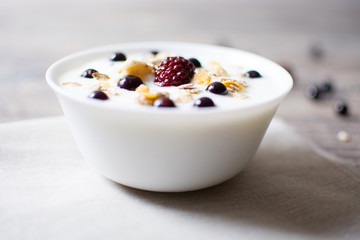Natural yogurt with fresh berries and cereals