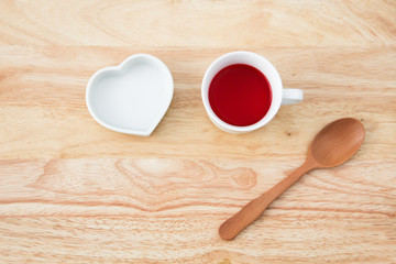 red heart cup,red drinking sweet water in a cup and the spoon