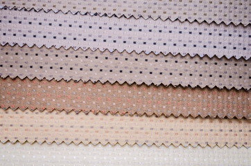 Scraps of colorful textile texture with dots pattern closeup