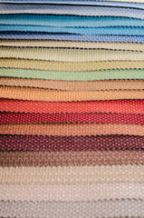 Scraps of colorful textile texture with dots pattern closeup