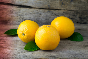 Orange on a wooden table. Selective focus.