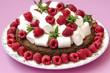 Oatmeal cake with marshmallow and raspberry  