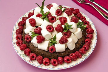 Oatmeal cake with marshmallow and raspberry  