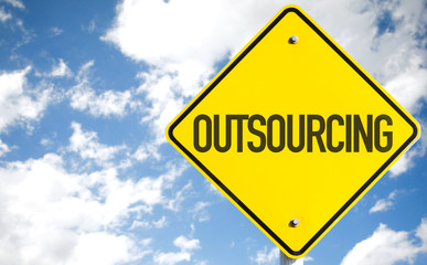 Outsourcing sign with sky background