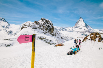 Fototapeta na wymiar Directional sign post with the background of Matterhorn.