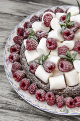Oatmeal cake with marshmallow and raspberry   
