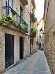 Fototapeta na wymiar Narrow street in Girona, Catalonia