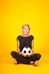 woman playing with a soccer ball