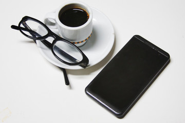 coffee with glasses and mobile tefefono