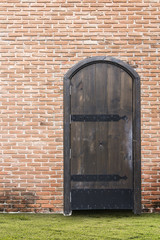 vintage wooden door and bricks wall
