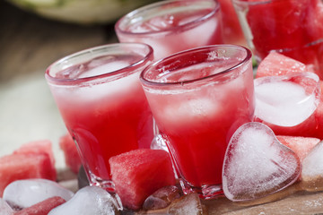 Watermelon cold drink with ice in a heart shape, selective focus