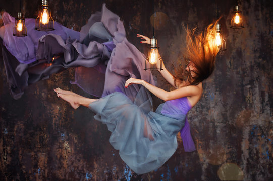 Girl hovers in the room at night.