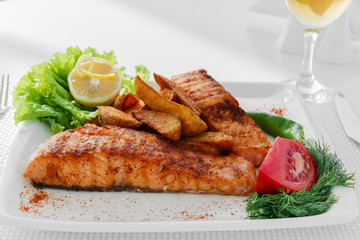 fried fish fillet of salmon with potatoes
