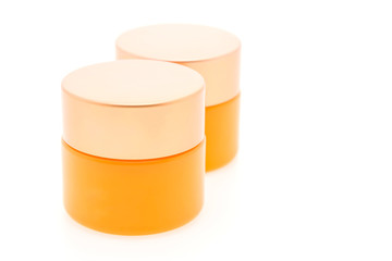 Blank orange cosmetic bottle cream isolated on white background