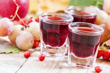 Homemade red wine glasses on the autumn background, selective fo