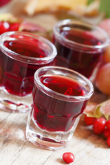 Homemade red wine glasses on the autumn background, selective fo
