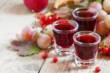 Homemade red wine glasses on the autumn background, selective fo