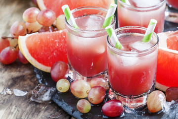 Grape-grapefruit cocktail with crushed ice, selective focus