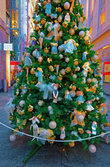 Fototapeta premium Traditional Christmas fir tree with gold and blue color decorati