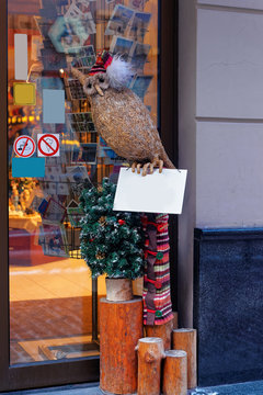 Stuffed owl figure at the entrance to a european shopping mall c