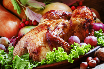 Festive baked chicken with autumn berries, fruits, nuts and vege