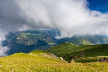 The formation and movements of clouds up to the steep slopes of the  mountains of Central Caucasus peaks.