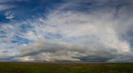 Naklejka na ściany i meble Clouds over the steppe.