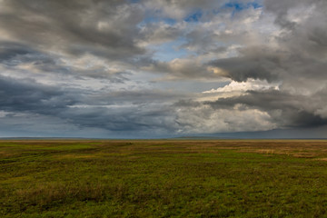 Obraz premium Clouds over the steppe.