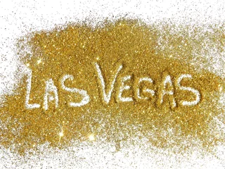 Foto op Plexiglas Inscriptie Las Vegas op gouden glitter schittering op witte achtergrond © mila_1989