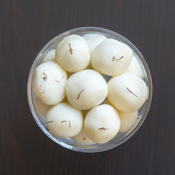 Indian sweetn Rasgulla is a syrupy dessert popular in the Indian subcontinent, and is made out of Indian cottage cheese and sugar syrup