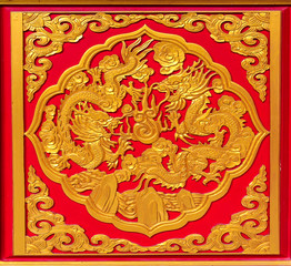 Pair of gold chinese dragon on red background