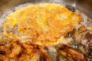 Pork meat frying in the frying pan