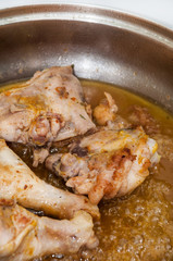 Frying chicken meat in deep hot oil