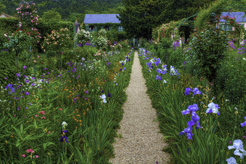 A path divides colorful flowers in Monet's Garden