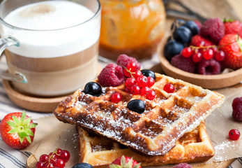 Belgian waffles with fresh berries and cappuccino