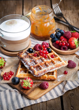 Belgian waffles with fresh berries and cappuccino