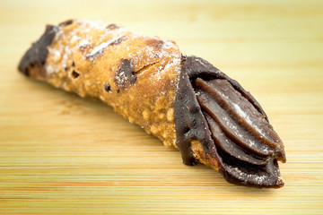 Delicious chocolate cannoli closeup macro