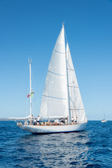 Elegant old italian style sailboat, on a wonderful blue sea, Sardinia, Italy