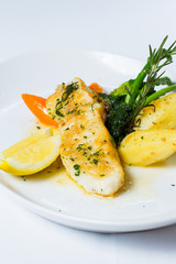 snow fish with a butter, lemon and rosemary