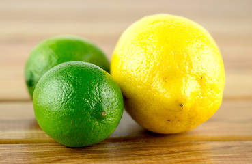 Two limes and a lemon on a bar table