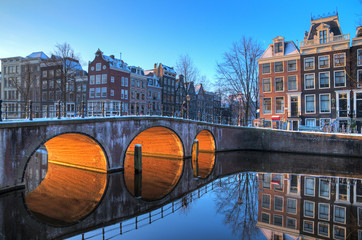 Beautiful early morning winter view on one of the Unesco world heritage city canals of Amsterdam, The Netherlands. HDR  - obrazy, fototapety, plakaty