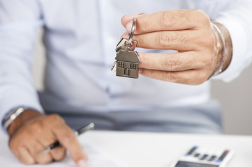 Hand with a house key