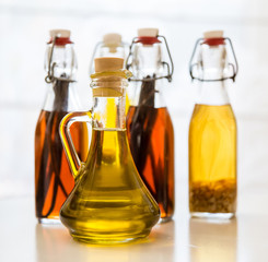  four bottls with homemade olive on the kitchen table