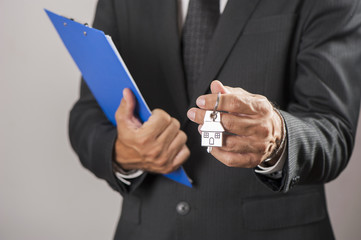 Hand with a house key