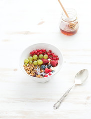 Healthy breakfast. Bowl of oat granola with yogurt, fresh