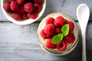 Healthy breakfast - fresh Greek yogurt with raspberries and mint