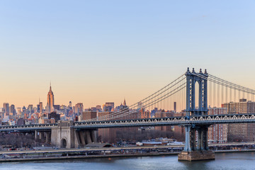 Fototapeta na wymiar New York city sunset with focus on Manhattan Bridge.