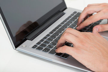 Person Hands Typing On Laptop