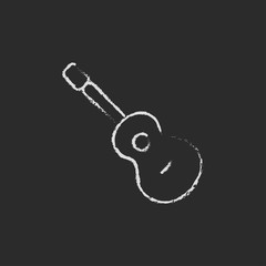 Guitar icon drawn in chalk.